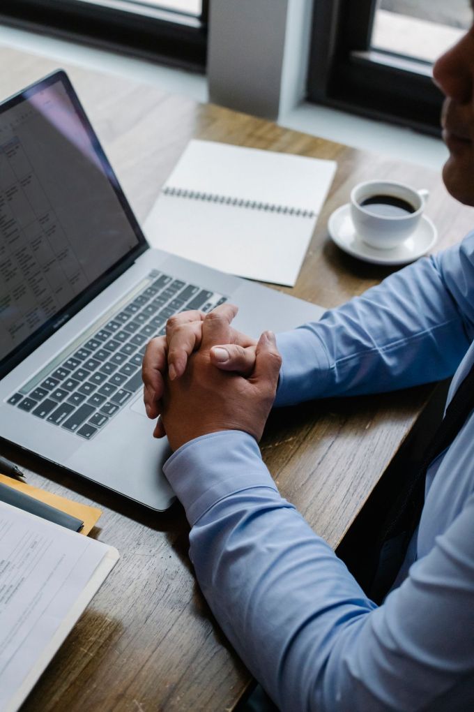 Employee using a laptop to check workplace benefits information