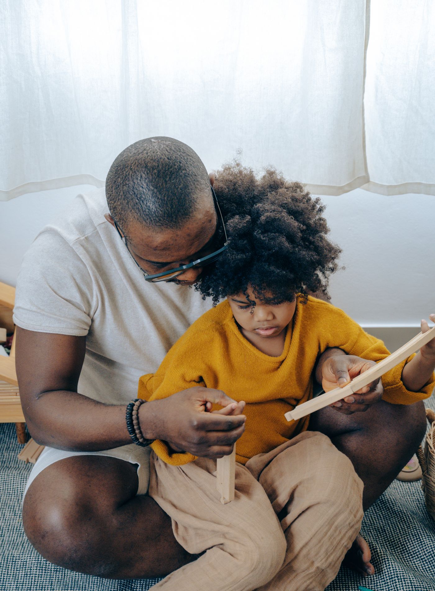 Father and child doing a creative hands-on craft activity at home