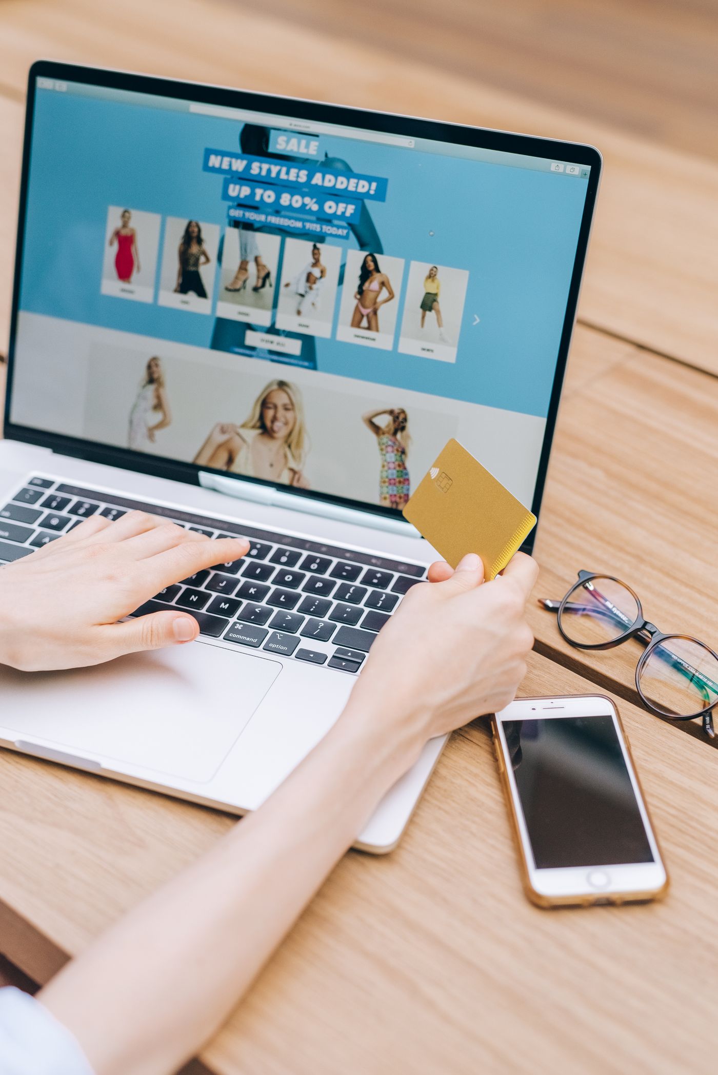 Online shopper checking product prices at a laptop