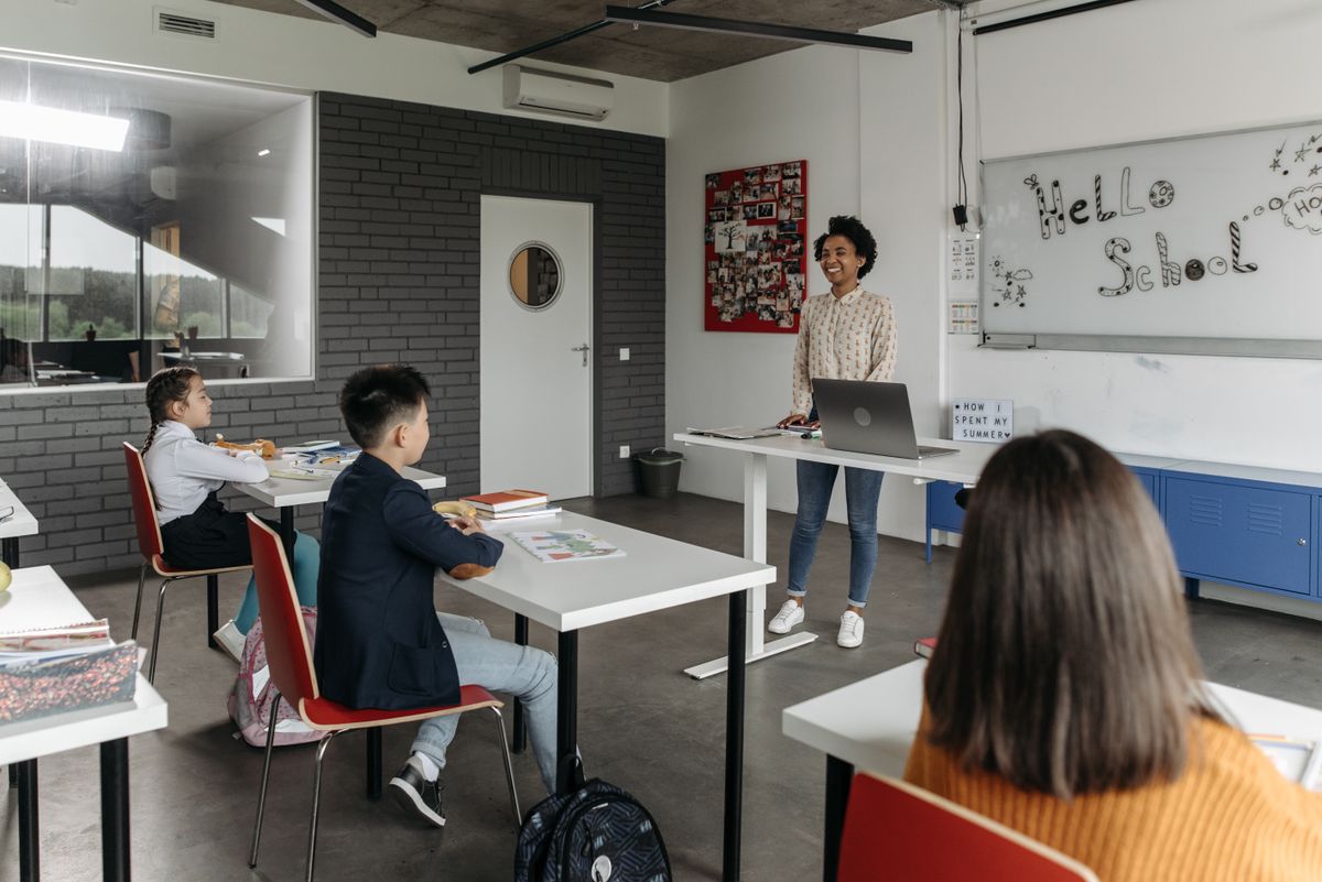 Educator working in a bright modern classroom